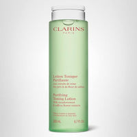 Thumbnail for Clarins Purifying Toning Lotion | Less Oily Skin After 14 Days of Use* | Cleanses, Hydrates, Purifies, Mattifies and Balances Skin's Microbiota | Contains Witch Hazel | Combination To Oily Skin Types