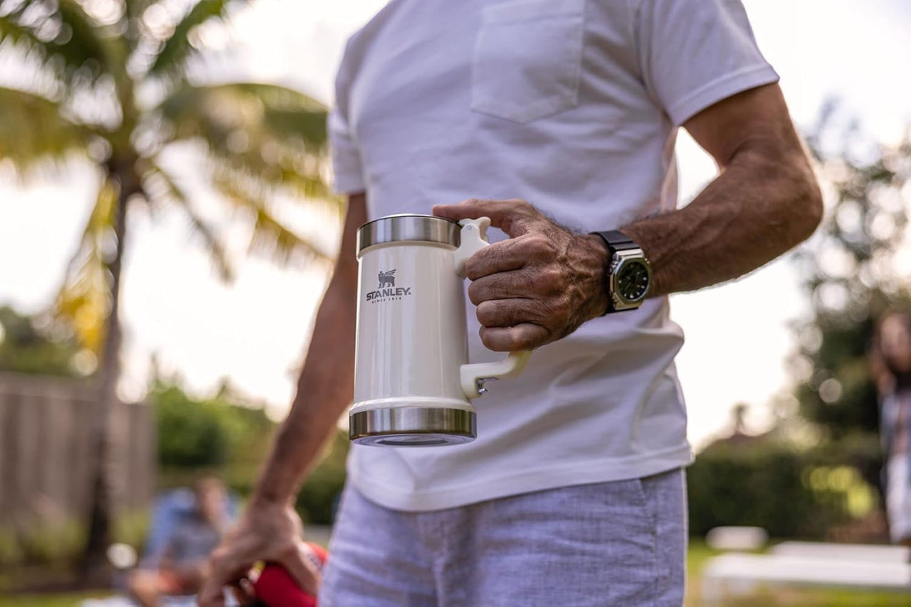 STANLEY Classic Bottle Opener Beer Stein 24 oz | Flip Up Lid and Heavy Duty Handle with Built In Bottle Opener | Insulated Stainless Steel Beer Mug | BPA-Free | Cream Gloss
