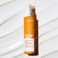 Thumbnail for Clarins Body Sunscreen Lotion Spray | Broad Spectrum SPF 50+ | UVA/UVB Protection | Lightweight and No White Cast | Enriched with Antioxidants | All Skin Types, including Sensitive Skin | 5 Ounces