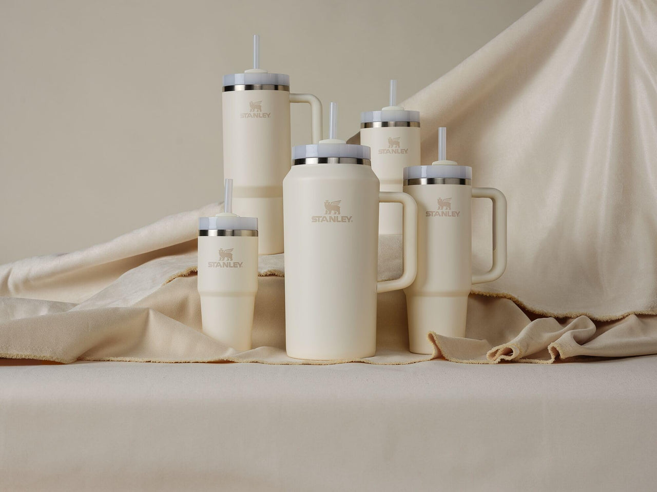 Stanley Quencher H2.0 Tumbler with Straw 20 oz | Flowstate 3-Position Lid | Cup Holder Compatible for Travel | Insulated Stainless Steel Cup | BPA-Free | Cream 2.0