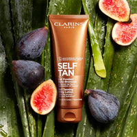 Thumbnail for Clarins Self Tanning Milky Lotion | Self Tanner For Face and Body | Natural, Long-Lasting, Streak-Free, Sun-Kissed Glow and 24-Hour Hydration* | Non-Staining | Contains Glycerin | 4.2 Ounces