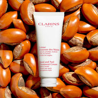 Thumbnail for Clarins Hand and Nail Treatment Cream | Award-Winning | Softens, Nourishes and Shields Skin | Strengthens Nails and Conditions Cuticles | Natural Plant Extracts, Including Shea Butter | 3.4 Ounces